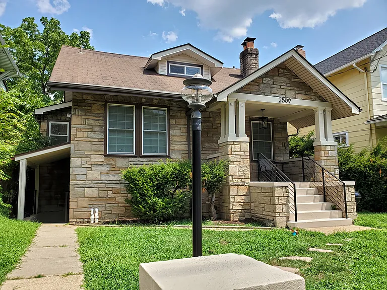 Front of house with enclosed yard.