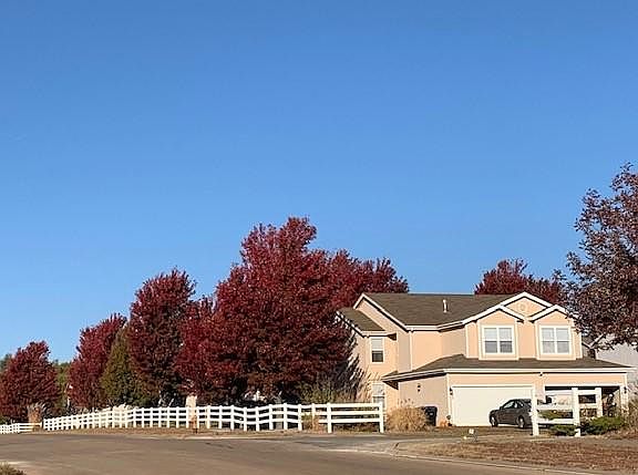 Established trees welcome you into the neighborhood.