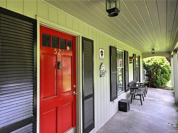 Pretty covered front porch welcomes you!