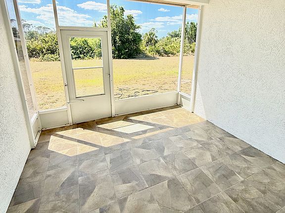 Lanai - freshly painted with new ceiling fan and tile floor