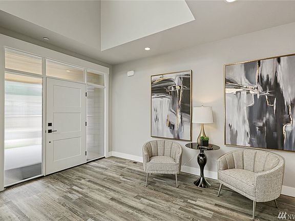 Grand Entry with vaulted ceilings.  LVP flooring is perfect for the NW with it's water proof feature.