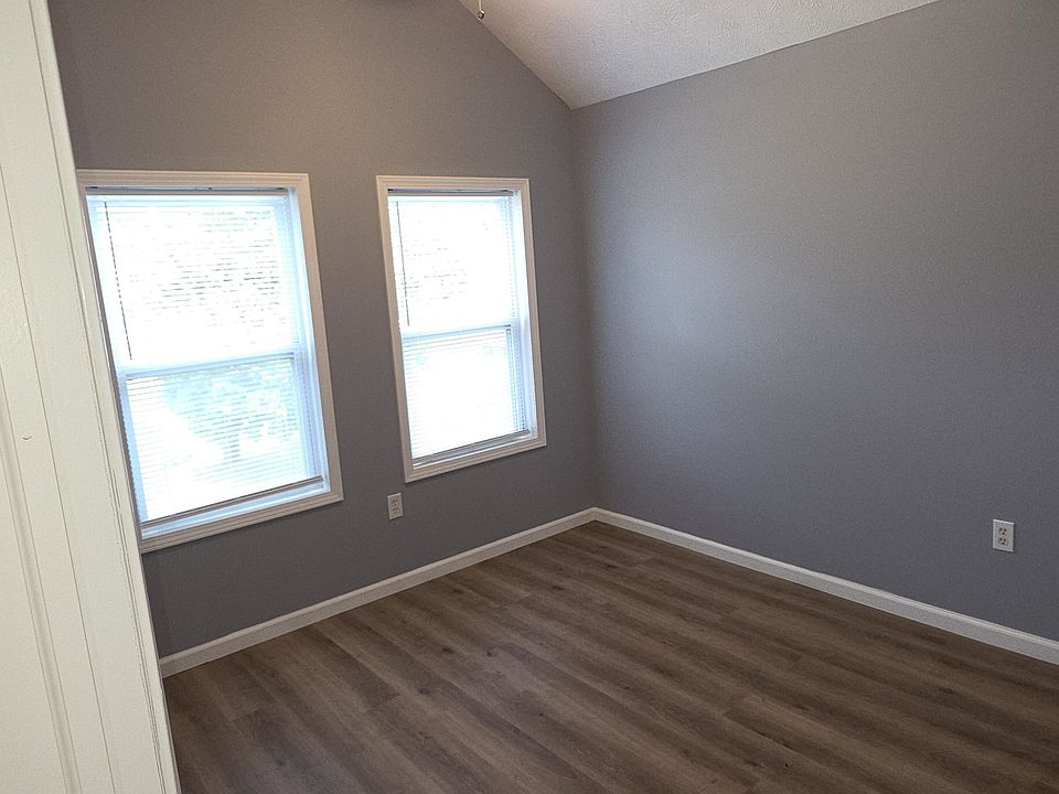 Primary bedroom has vaulted ceiling and nice sized closet