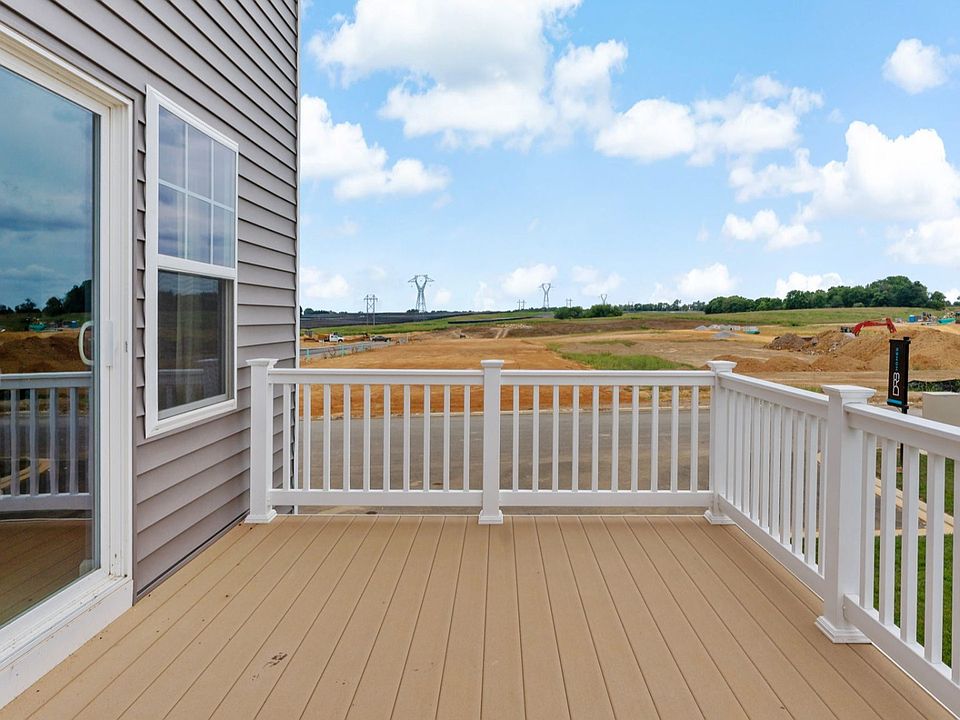 Spacious balcony in York II South Brook Townhome by DRB Homes with scenic views and comfortable seat