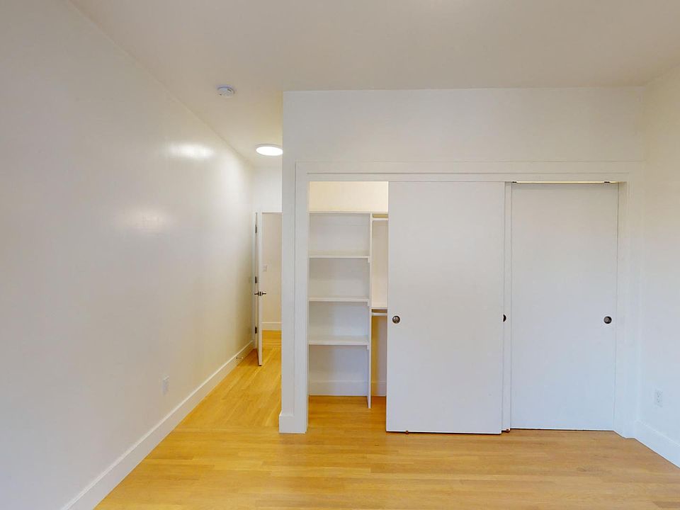 Bedroom with a wood-like flooring and a closet