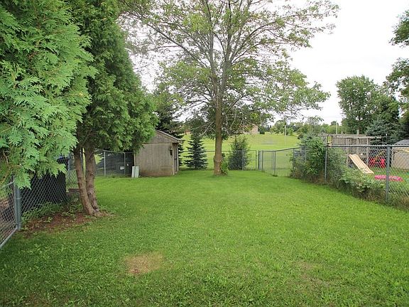 Nice fenced back yard with shed