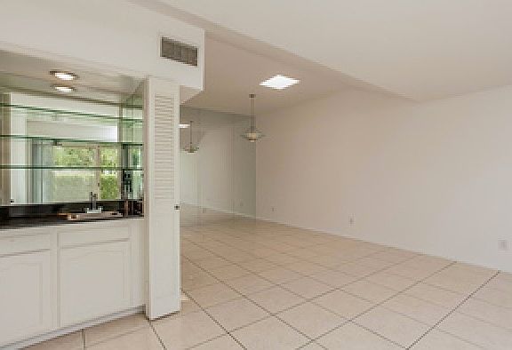 very clean, light, tiled floor