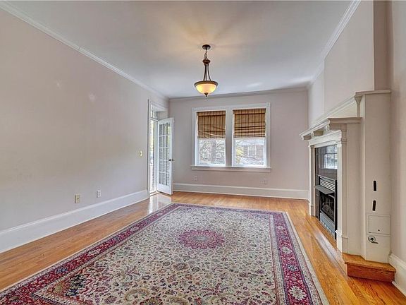 View of living room with lovely natural light. Access porch off of the left corner