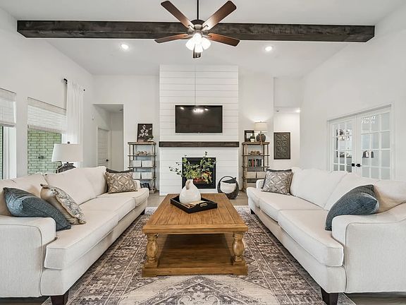 Great room with optional fireplace and optional stained ceiling beams