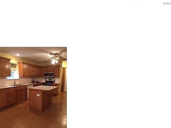 Large kitchen with a surplus of cabinets. All appliances stay.