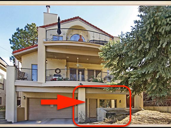 The entrance (and off-street parking) is in the rear of the home.