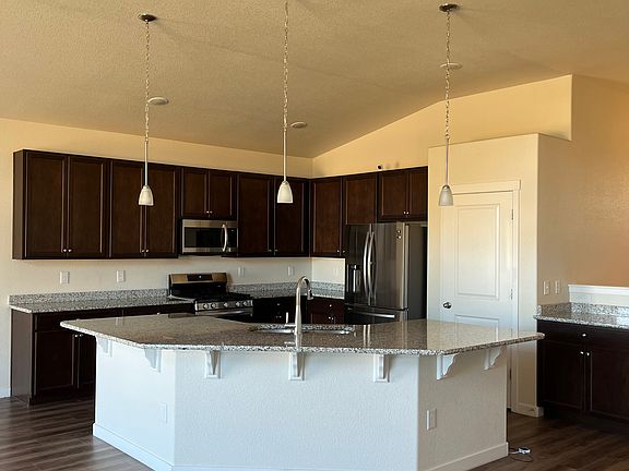 kitchen with very large granite island