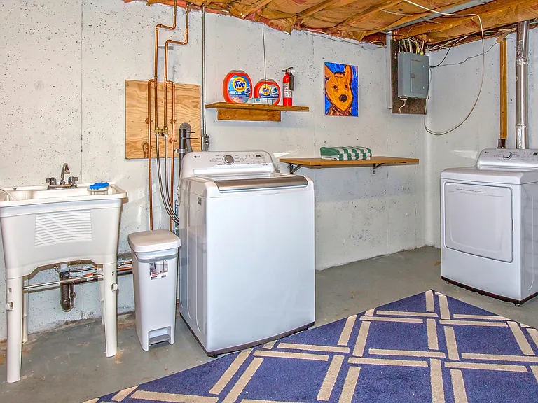 Laundry room is in basement with new LG Washer & Dryer