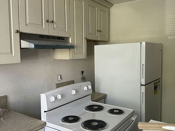 Kitchen with new appliances, just finishing painting.