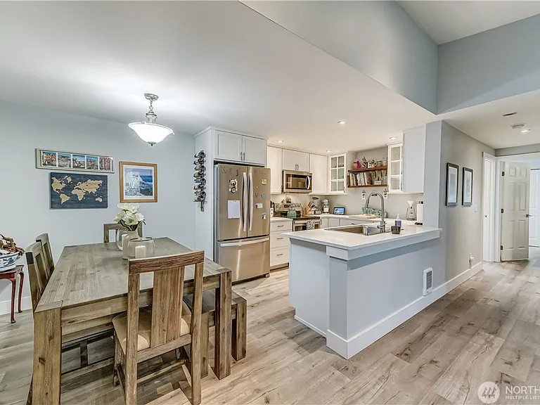 Welcome Home! 

This remodeled kitchen features custom cabinetry, quartz countertops, stainless steel appliances, and abundant workspace, making it as functional as it is attractive.