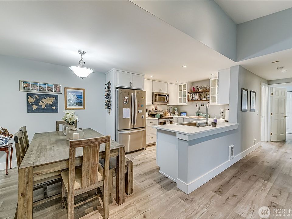 Welcome Home! 

This remodeled kitchen features custom cabinetry, quartz countertops, stainless steel appliances, and abundant workspace, making it as functional as it is attractive.