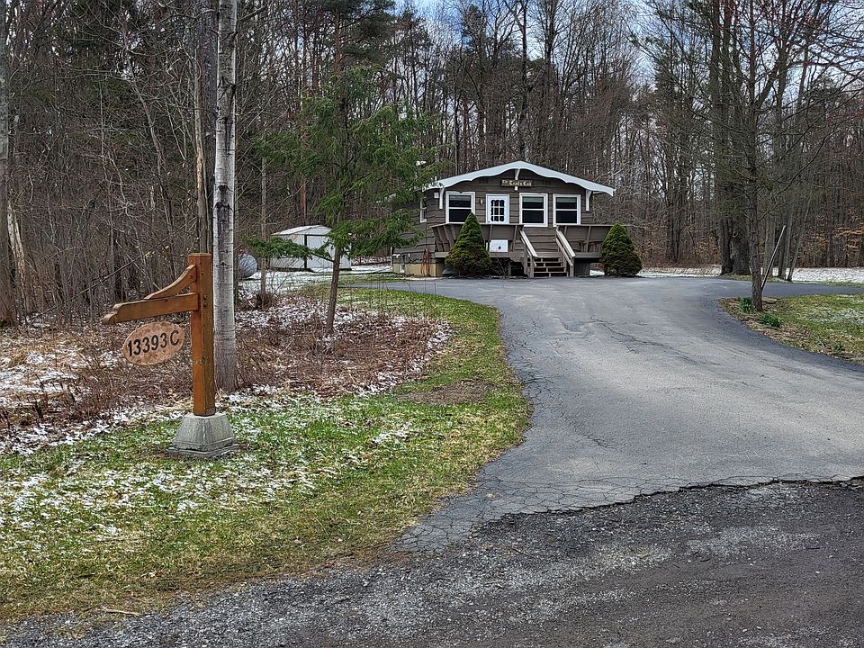 Exterior view of cabin and backyard storage shed