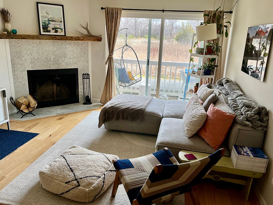 Livingroom, fireplace, sunny fall view of the marsh.