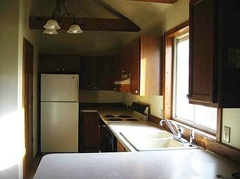 Galley type kitchen with newer cabinets