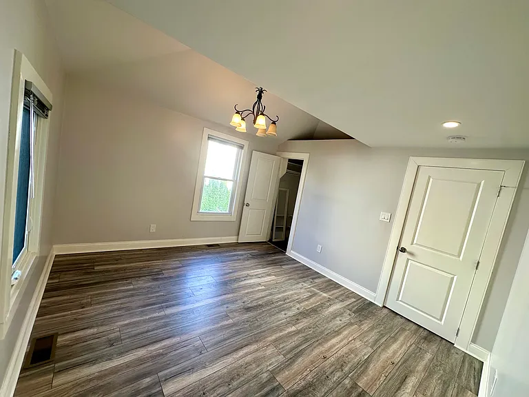 Large third bedroom with vaulted ceiling and deep closet