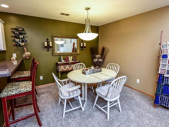 Dining room area off the living room and breakfast bar that leads you into your kitchen.