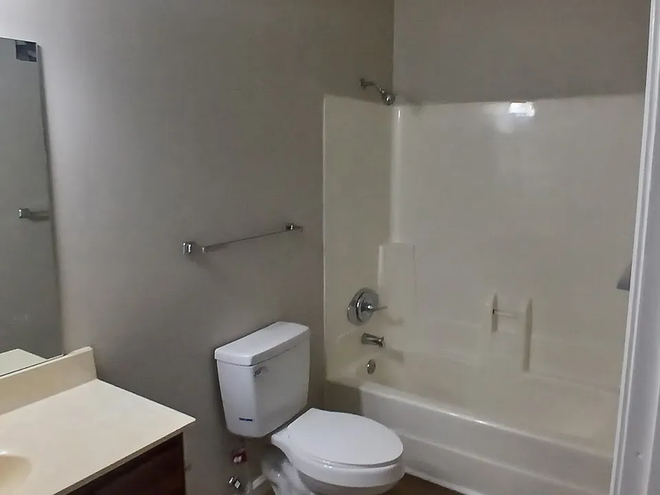 Full bathroom with tub/shower combo.