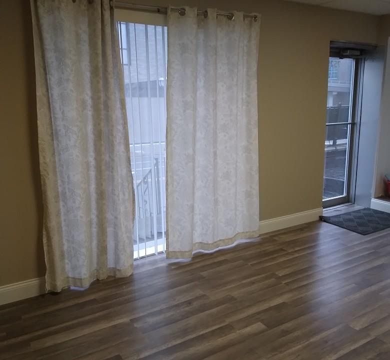 Front Room with large glass window and glass door which provides plently of ample light.