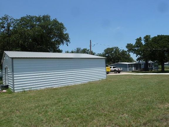 30X 40 SHOP. FOAM INSULATION, 220 ELECTRIC, 5 TON 2 STAGE AC UNIT, CONCRETE FLOOR, OVERHEAD ROLL UP DOOR, SIDE WALK IN DOOR.