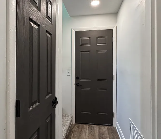 Lower Level Hallway to Family Room, Utility/Laundry Area & 2 Car Garage