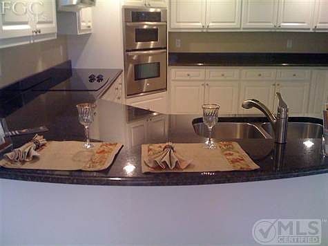 Oversized kitchen complete with granite, stainless steel appliances and more cabinets than you can use.