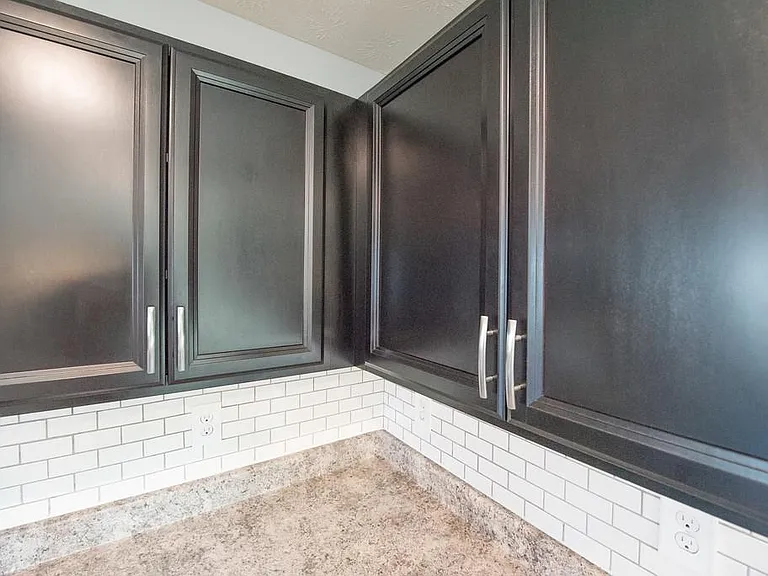 Dark Espresso Cabinets with Brushed Nickel Hardware.