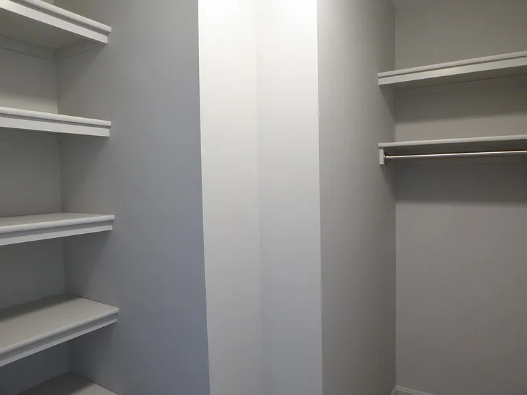 Additional large closet space with well-designed built-ins.