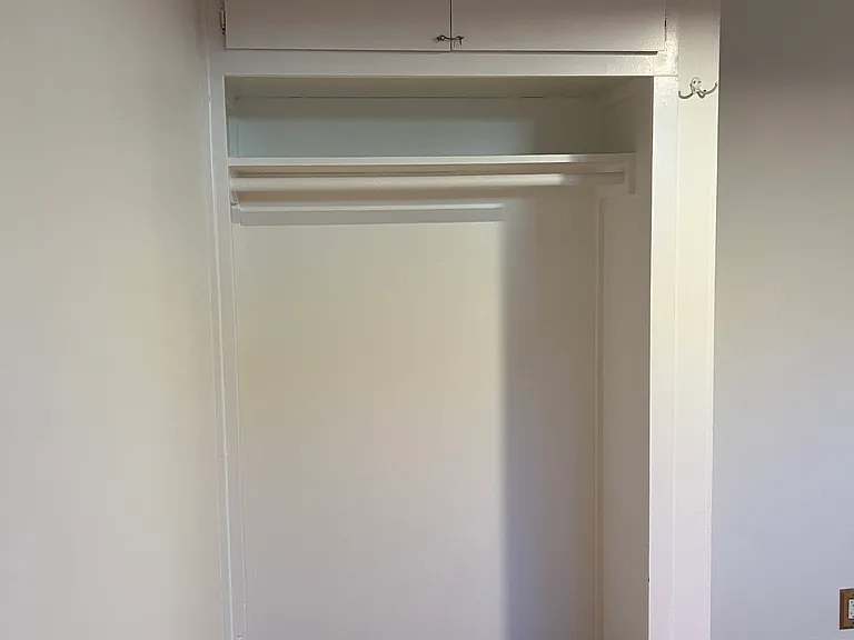 This is the bedroom closet. Deep storage above.