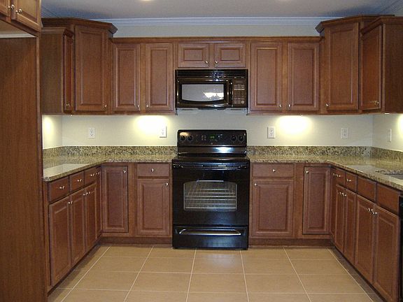 Maple Cabinets and Granite Countertops in Kitchen.