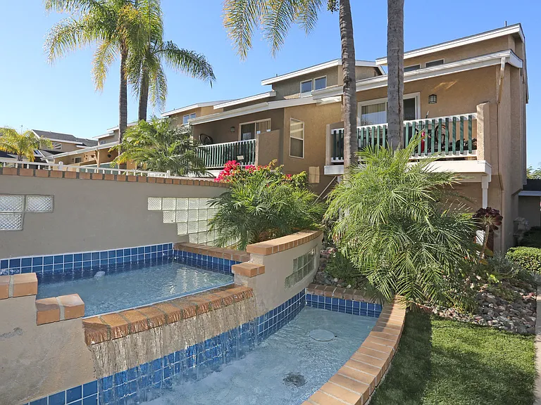 Display of multi-level waterfall at property entrance