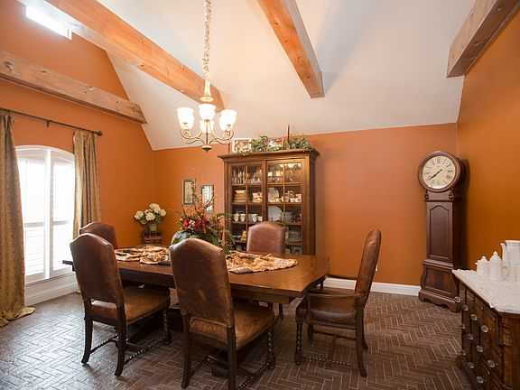 Large formal dining w/beamed ceiling