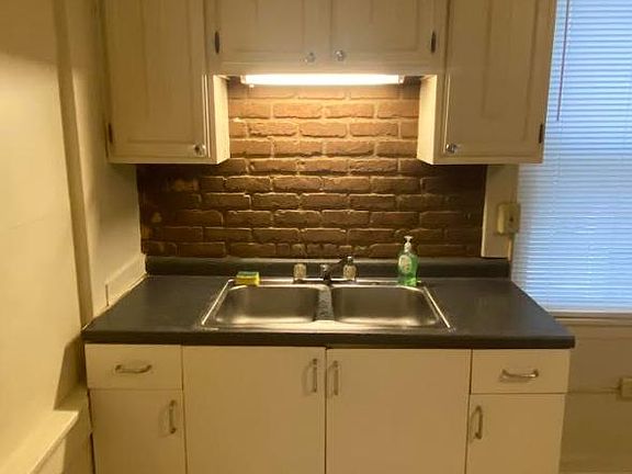 kitchen sink, countertop, & cabinets
