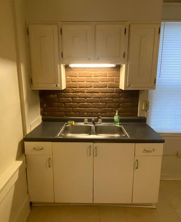 kitchen sink, countertop, & cabinets