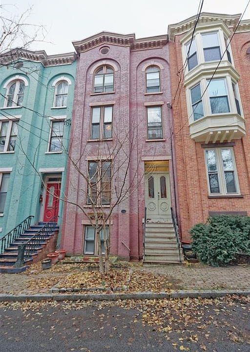 View of full row house. Private apartment entry is below the front stoop. Exterior will be freshly painted in summer 2019.