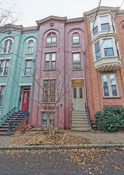 View of full row house. Private apartment entry is below the front stoop. Exterior will be freshly painted in summer 2019.