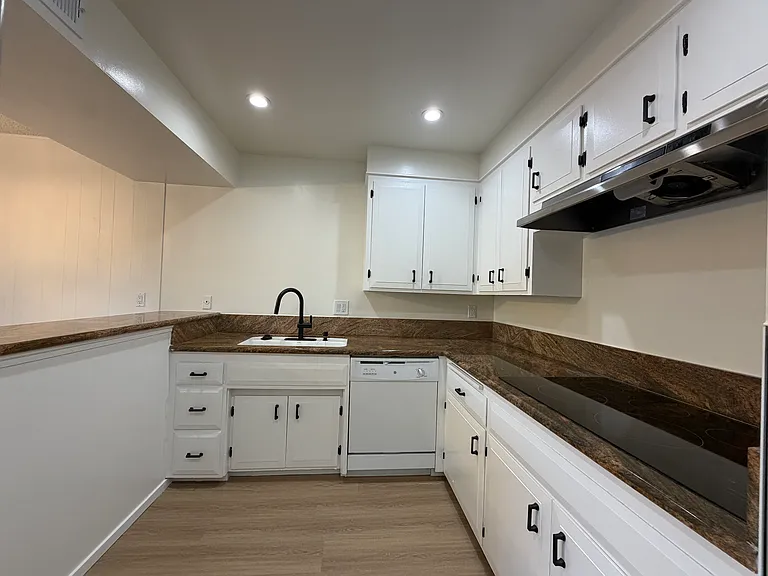 Kitchen with Granite Counter, Smooth Cooktop, & Large Stainless Steel Fridge