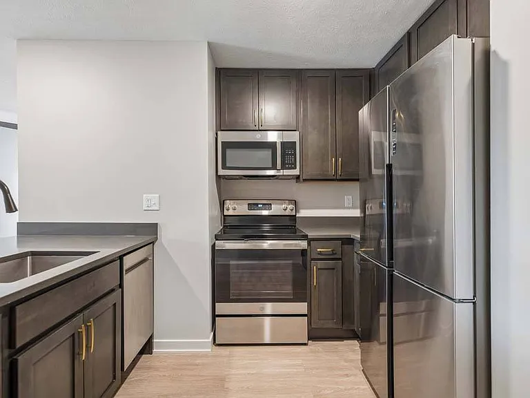 Stainless steel appliances and rich cabinetry bring a polished, contemporary feel to this well-appointed kitchen.