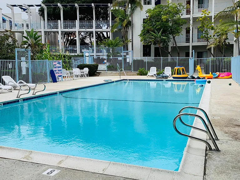 Gated pool, jacuzzi within the fence on the far end