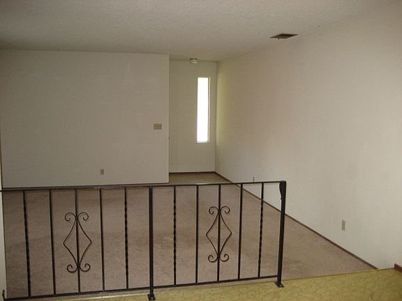 Living room and front entry from dining area