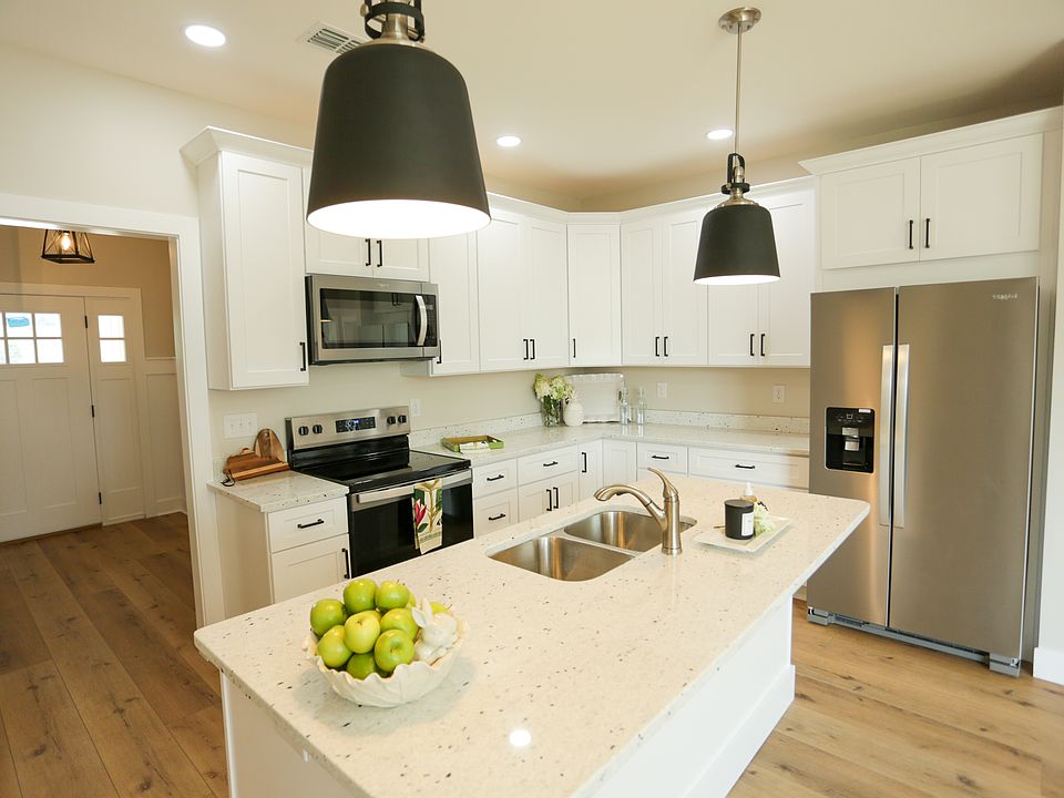 Back cottage custom cabinets, large kitchen island accommodates four stools