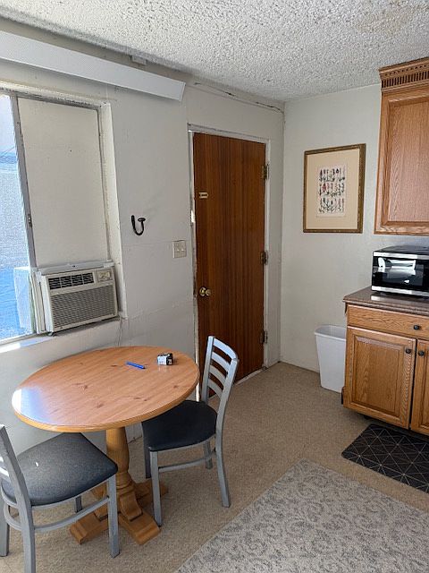 Eating nook. Front door and part of the kitchen to the right.