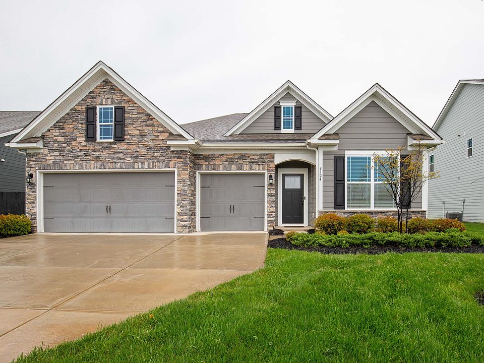 Front yard w/ 3-car garage