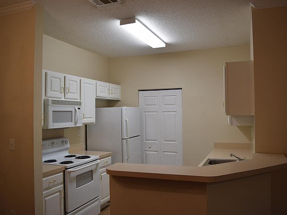 Kitchen with separate laundry room. Appliances included are