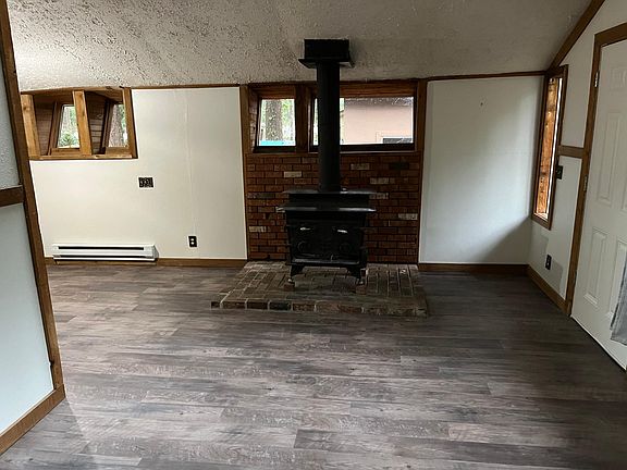 Wood Stove is secondary heat with electric baseboards as main heat source.