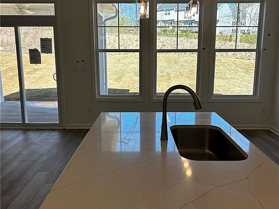This spacious kitchen with a large island and ampl
