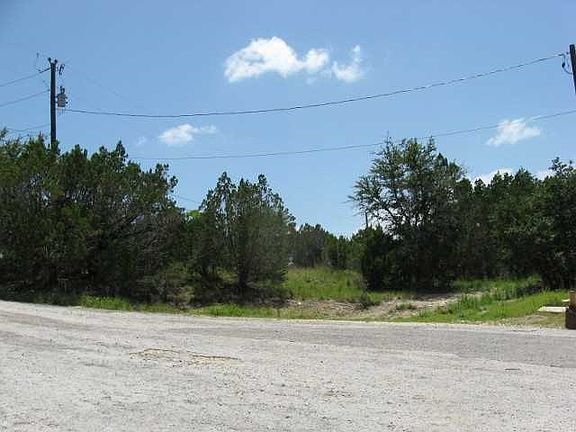 View from culdesac.  Few small oak trees